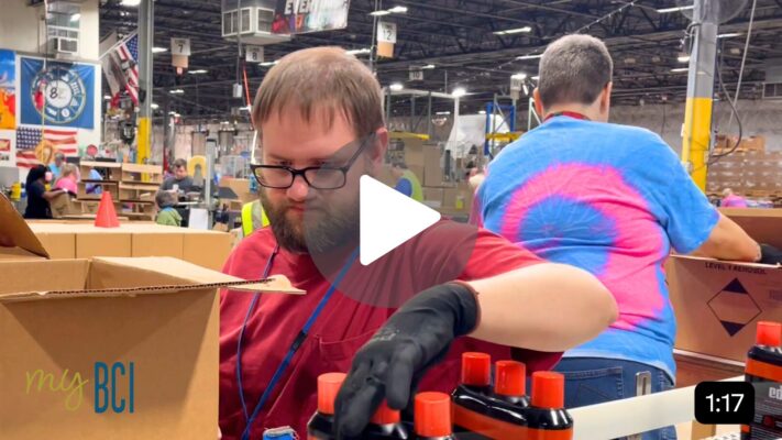 Photo of a young man with disabilities working at BCI