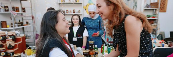 Young woman with disabilities at a business during a job shadow